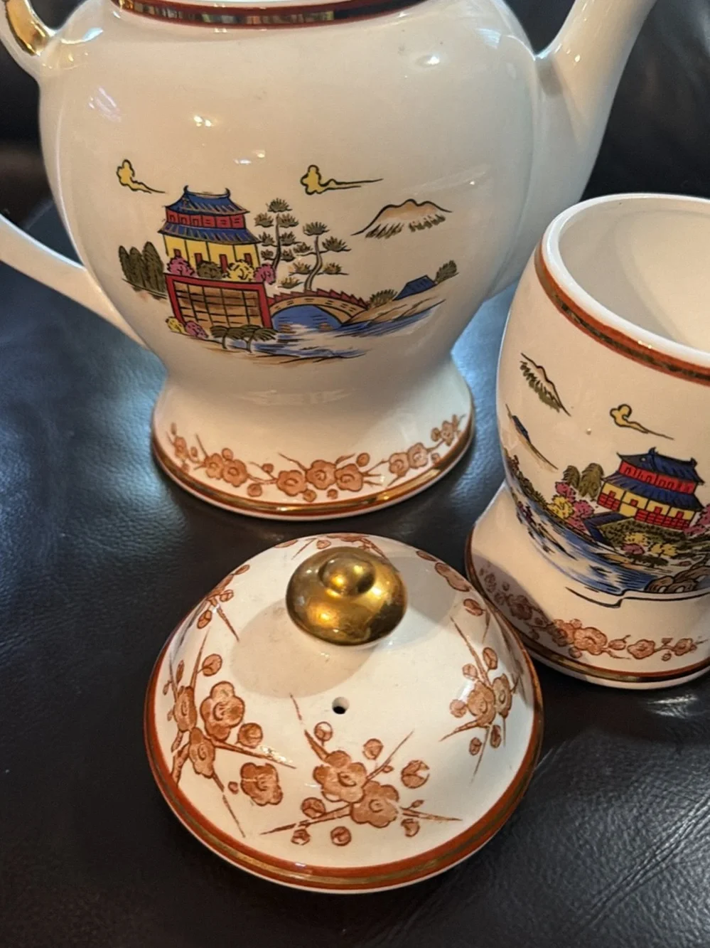 White Ceramic Tea Set with Gold Trim and Oriental Scenic Design